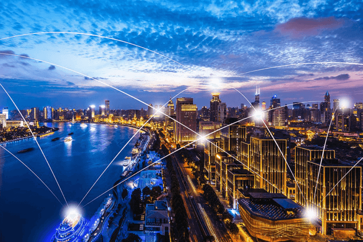 city with lines of light showing interconnectivity between buildings