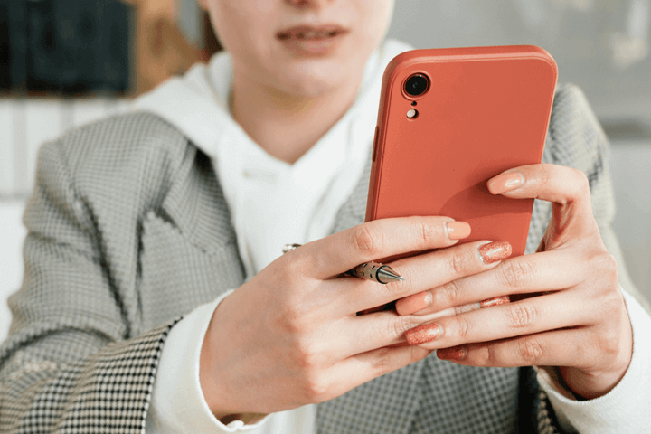 Women holding phone using a power app