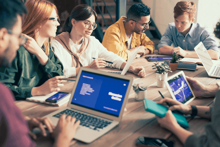 group working together on laptops