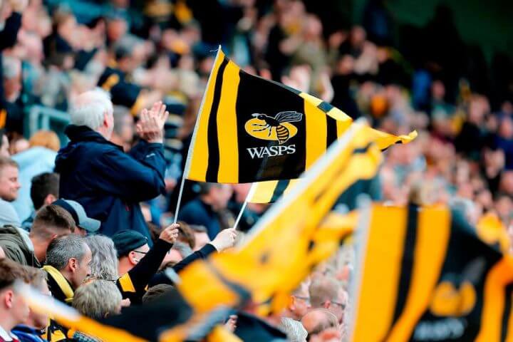 Wasps rugby supporters flying flags in the stands