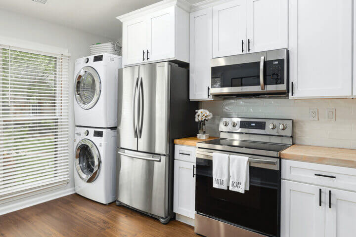 Modern kitchen with fridge, washer and drier etc.